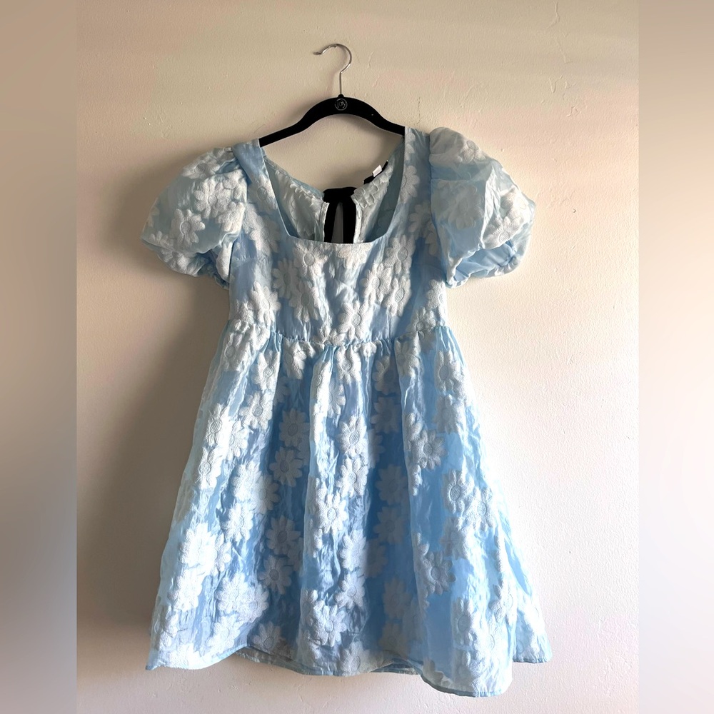 Top shop blue dress with cute black bow tie in back. Size 6.